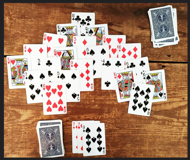 How to Play Pyramid Solitaire - Rules, Strategies, & Variations
