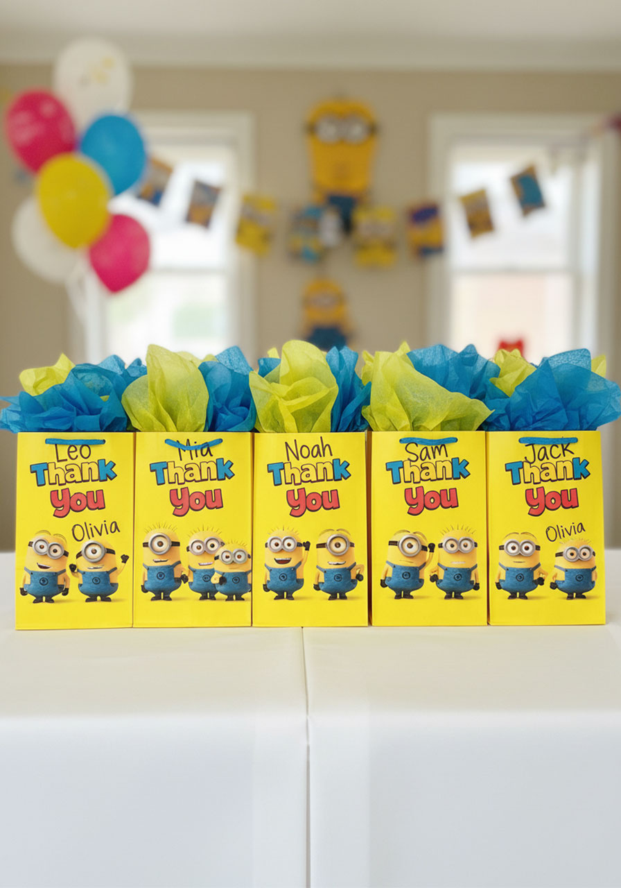 Personalized Minions party favor bags filled with treats and labeled with names for birthday guests