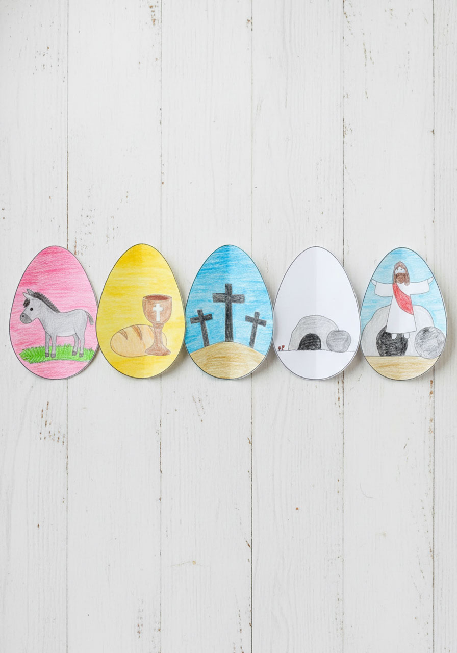 Five completed colored egg panels showing all Easter story scenes laid flat before assembly