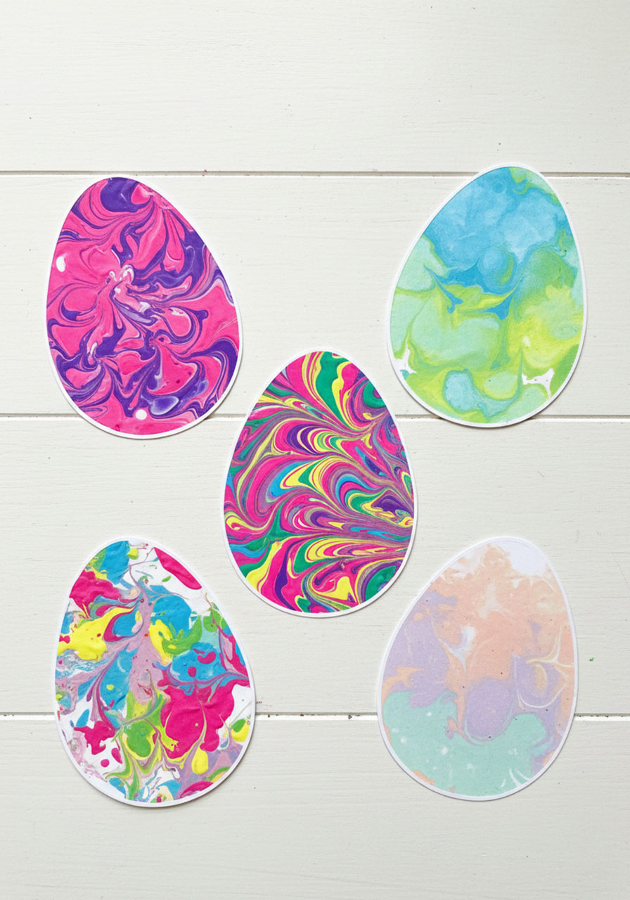 Five different shaving cream marbled Easter eggs displaying variety of swirl patterns and color combinations