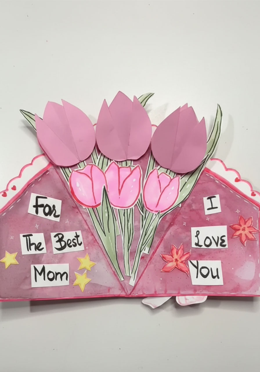 DIY 3D tulip bouquet card open showing three pink paper tulips on stems and handwritten "For the Best Mom I Love You" message panels