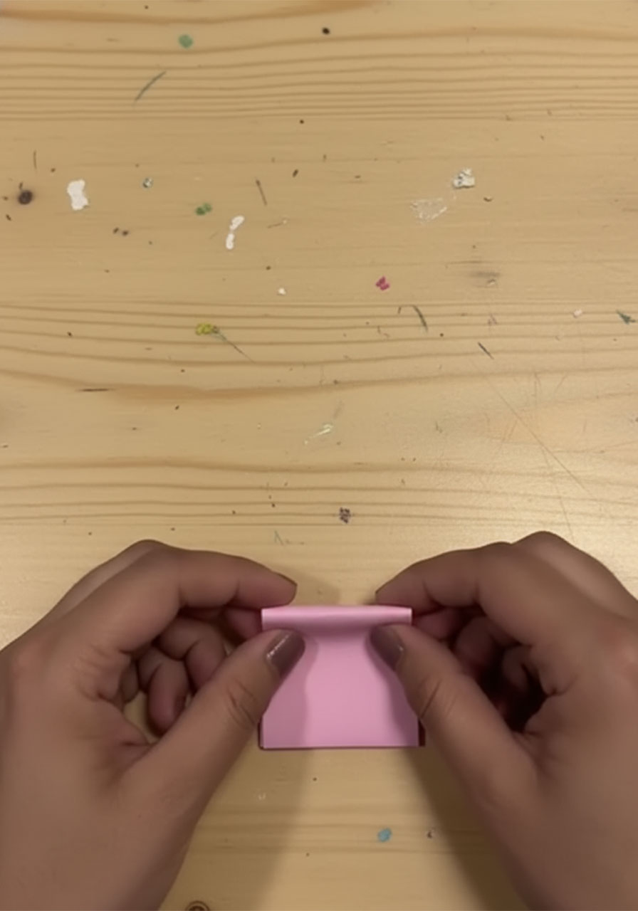 Step-by-step flat lay showing how to fold a 3D paper tulip for a DIY Mother's Day bouquet card, five stages from flat square to finished flower step1h
