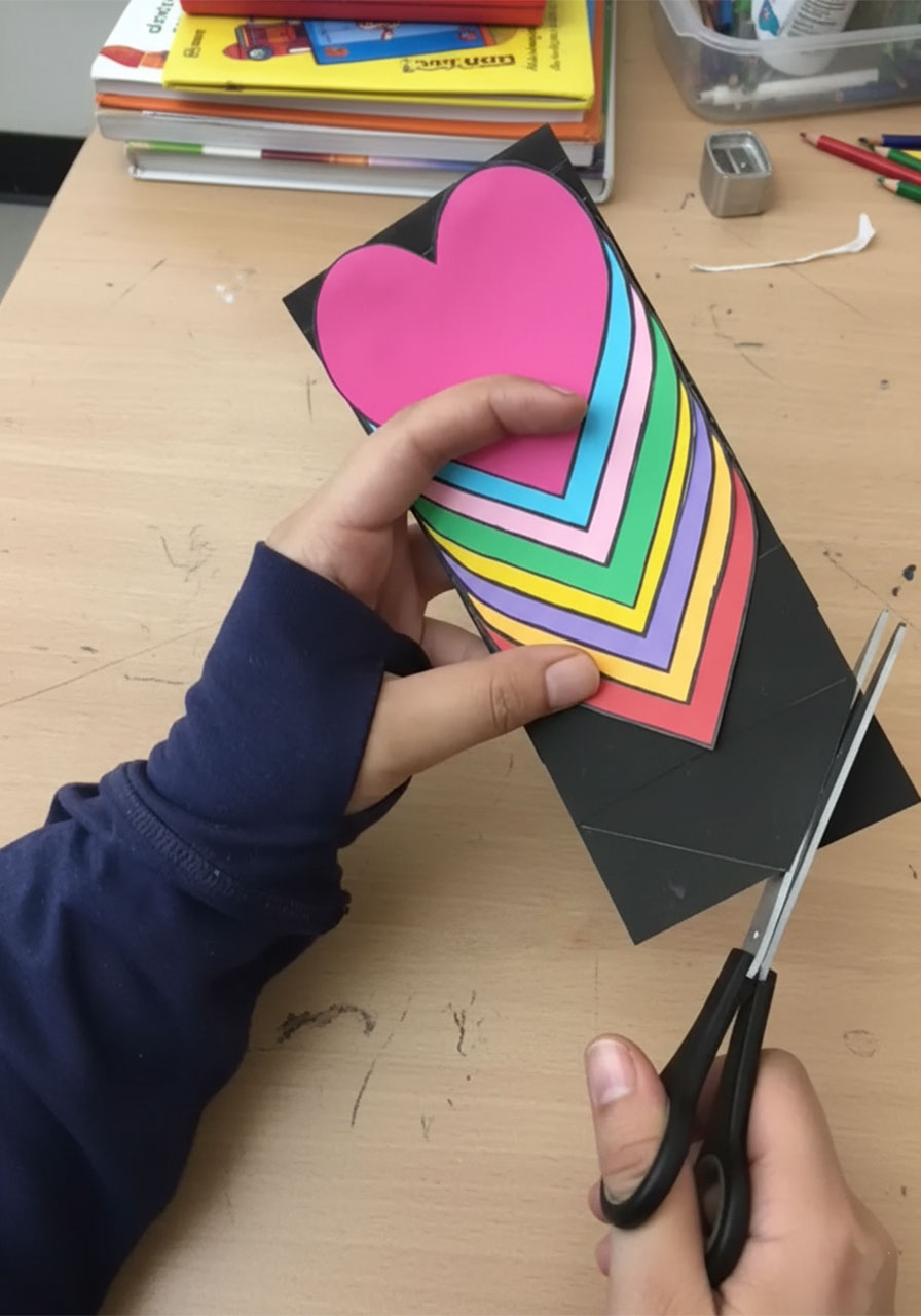 Close-up of the PULL tab on a DIY Mother's Day heart waterfall card showing how the sliding mechanism works step7a