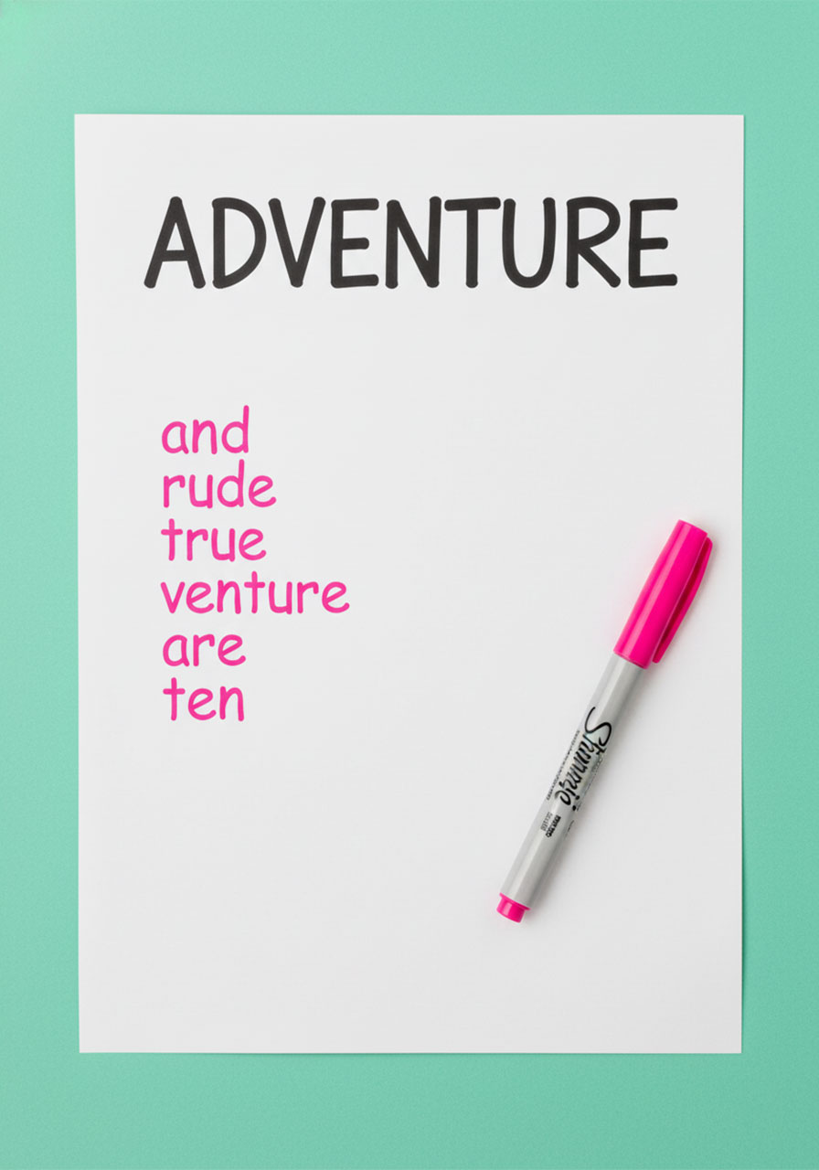 Words Within a Word pen and paper game showing ADVENTURE written at top with smaller words found inside it listed below in pink marker