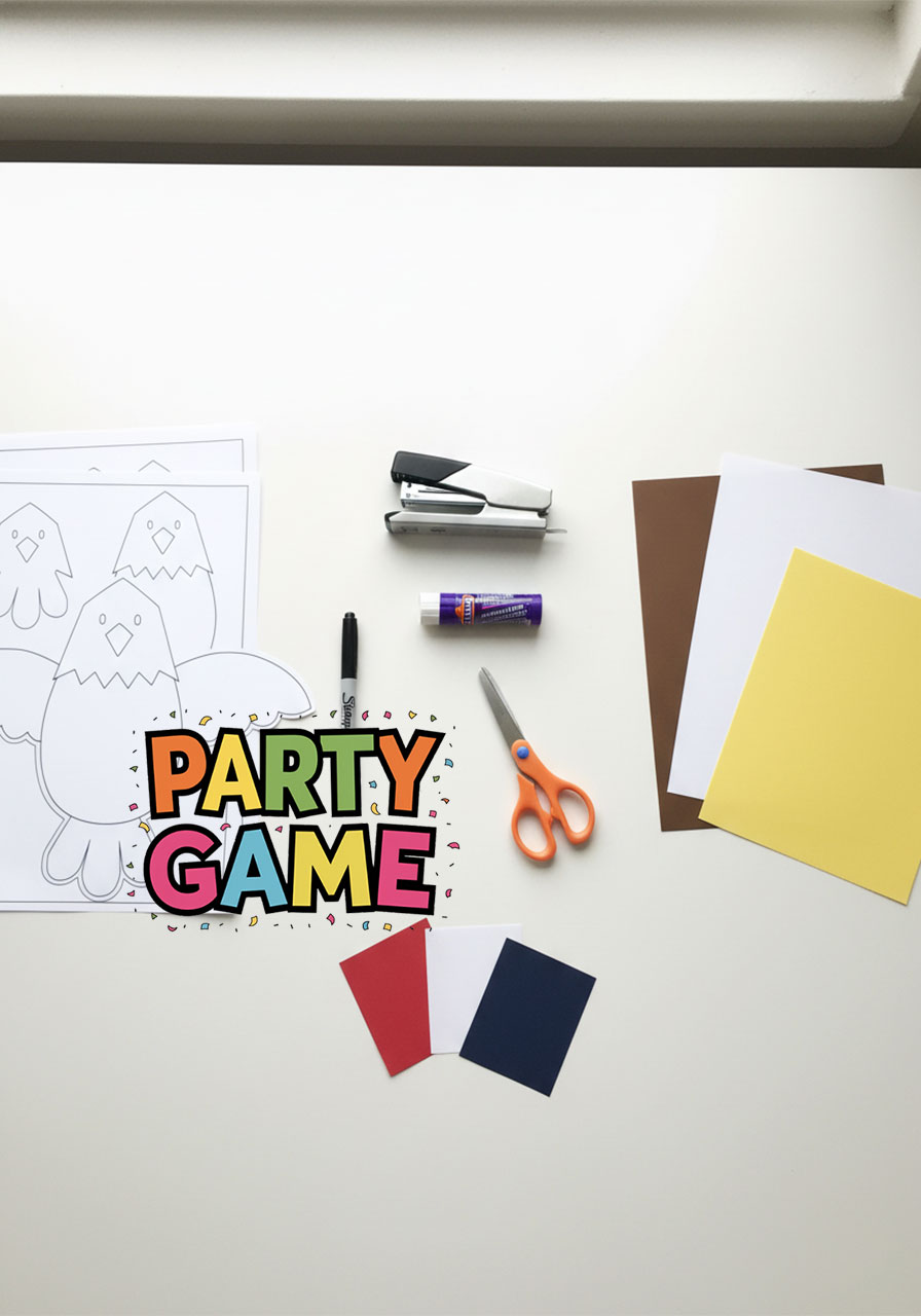 All supplies needed for bald eagle paper craft including colored paper glue stick scissors and stapler laid out flat