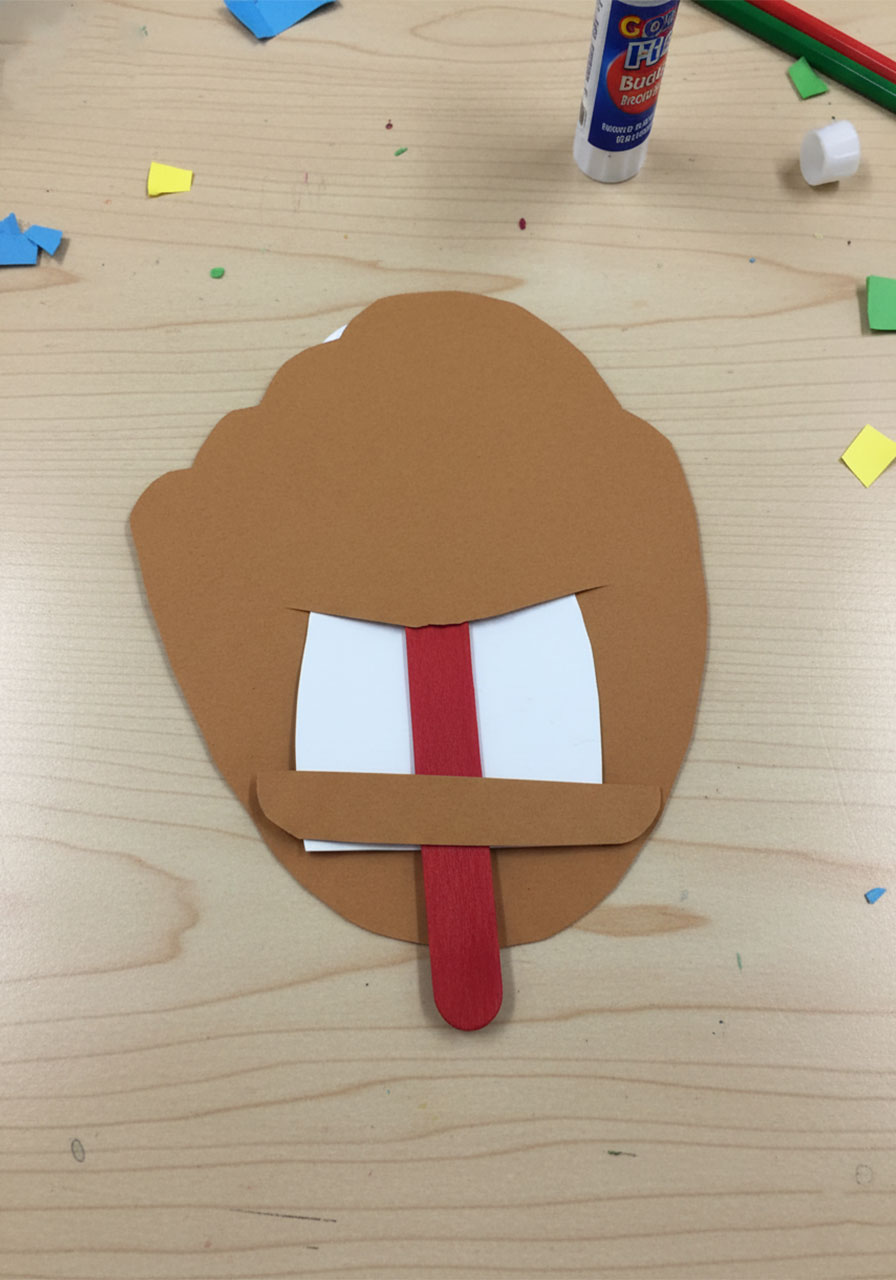Back view of baseball glove Father's Day pop-up card showing the craft stick mechanism, slit, and stopper tab assembly
