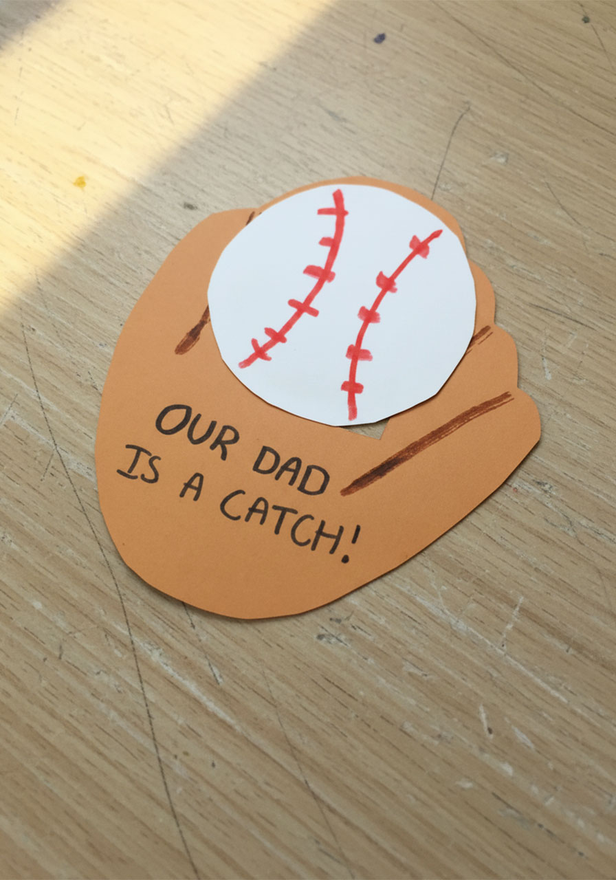 Finished handmade baseball glove pop-up Father's Day card with "Our Dad Is A Catch" message, front view