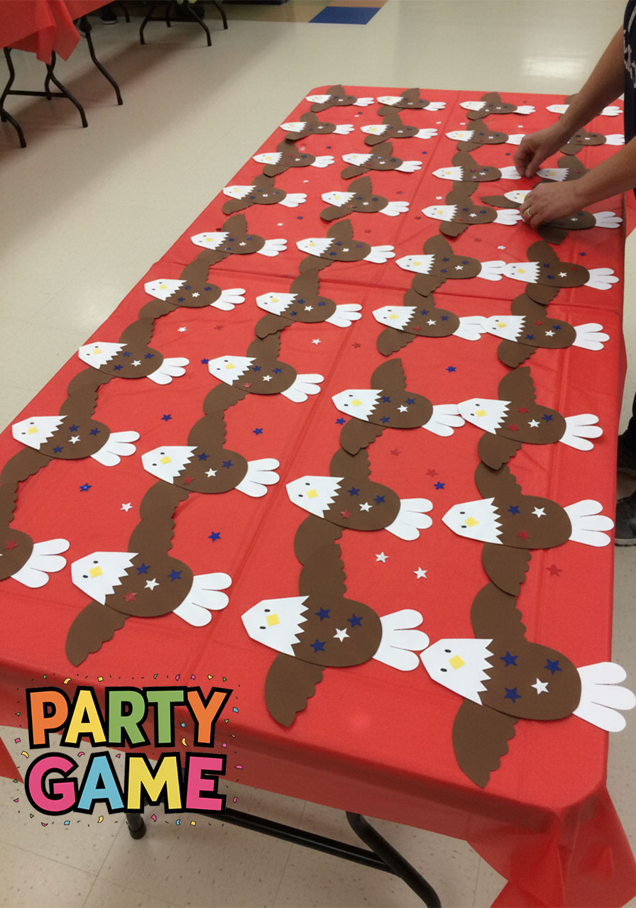 Display of 20 completed bald eagle paper crafts made by kids for a patriotic classroom or party activity