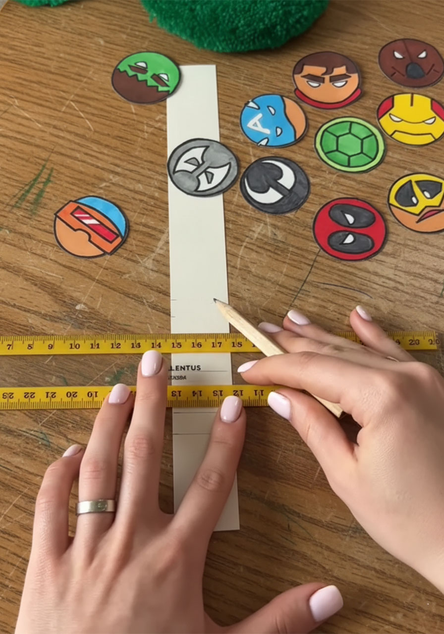Measuring and marking even fold lines on a cardstock accordion strip for the DIY pop-up Father's Day card mechanism phase 2 step 3a