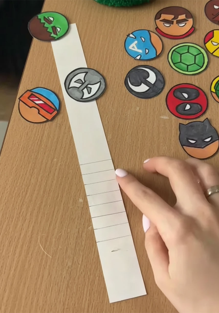 Measuring and marking even fold lines on a cardstock accordion strip for the DIY pop-up Father's Day card mechanism phase 2 step 3b