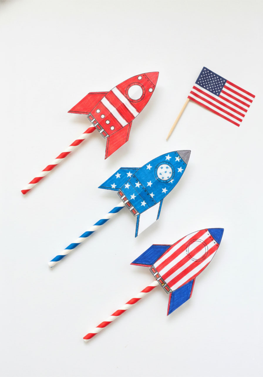 Three patriotic red white and blue paper straw rockets for a 4th of July kids craft activity