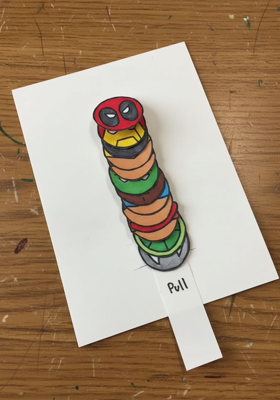 Writing the Pull label on the pull-tab strip of the DIY pop-up superhero Father's Day card	phase3 step5