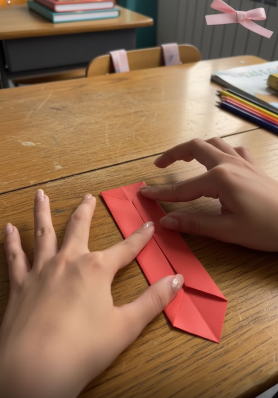 Three stages of folding a red origami necktiae for a DIY Father's Day suit-and-tie card, from flat paper to completed 3D tie with knot step3c