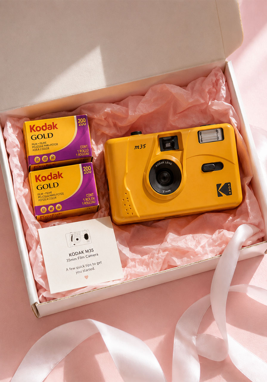 Kodak film camera and film rolls in gift box as thoughtful 21st birthday gift set for capturing memories