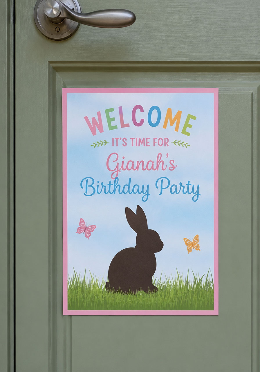 Personalized bunny and butterfly birthday party welcome sign on a sage green front door with pastel bunny and butterfly design