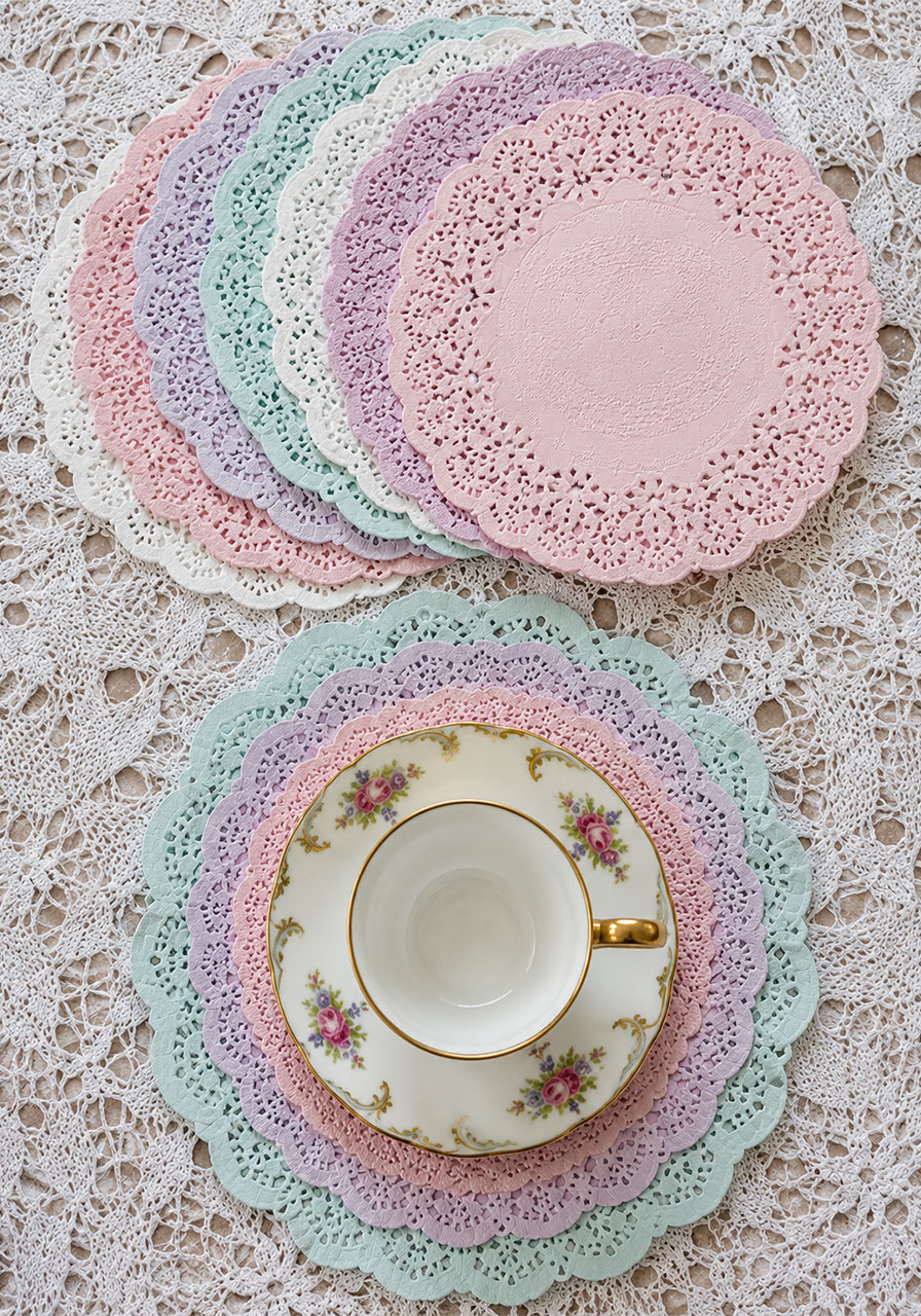 Pastel dyed doily coasters and place mats for tea party table decor