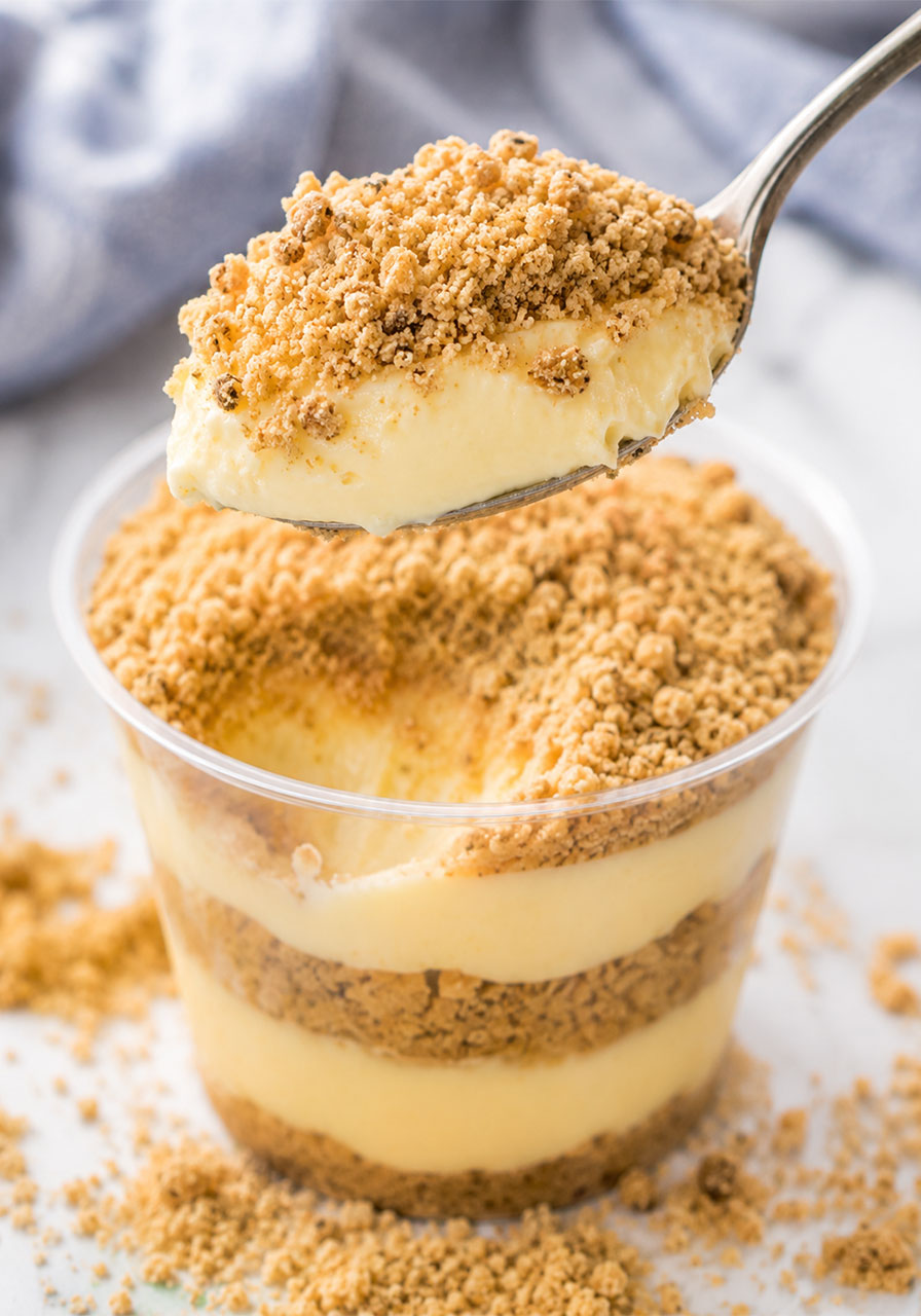 A spoonful of Golden Oreo Sand Pudding showing the creamy pudding and cookie sand layers