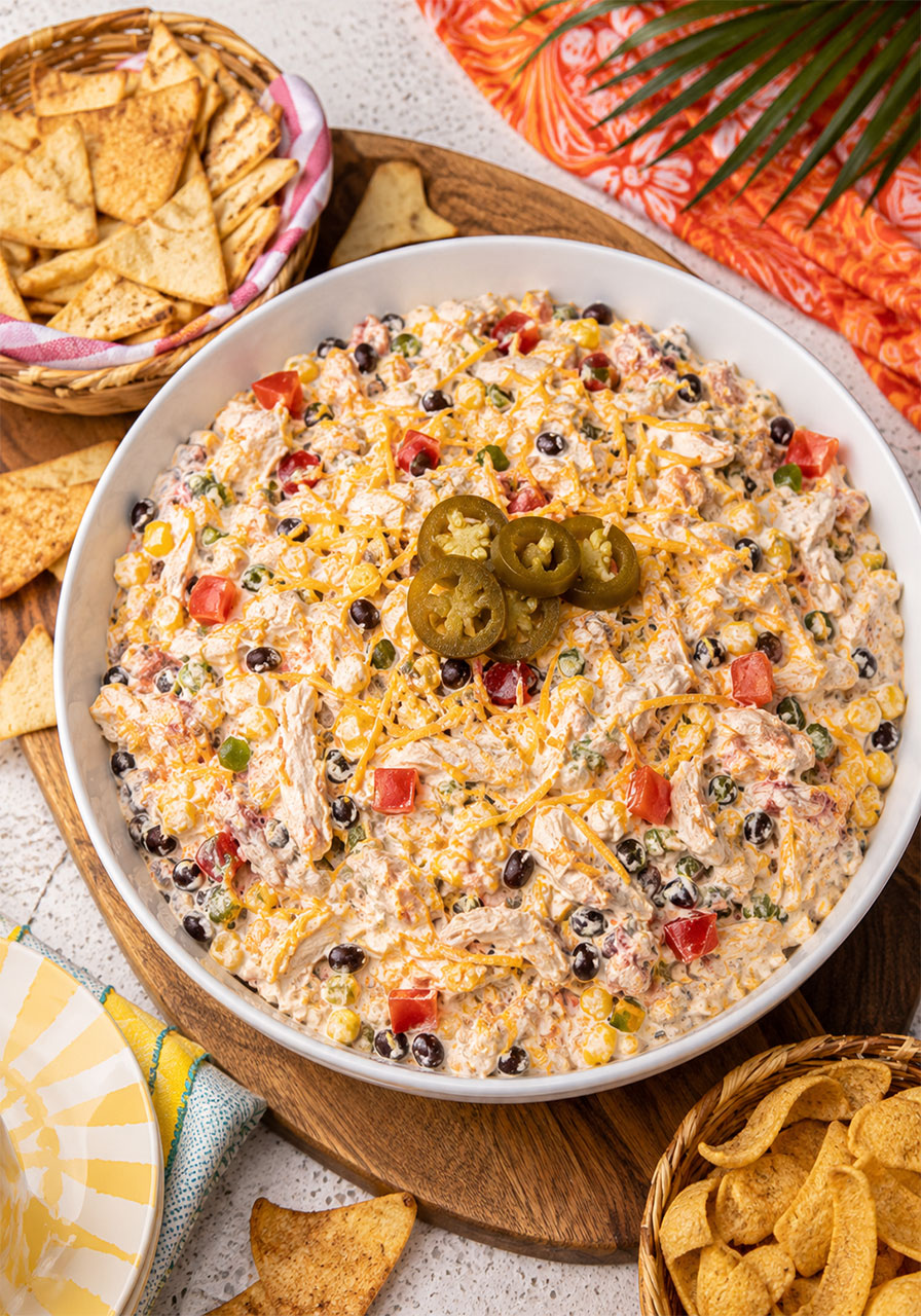 Hearty TikTok boat dip variation with shredded chicken and black beans in white bowl