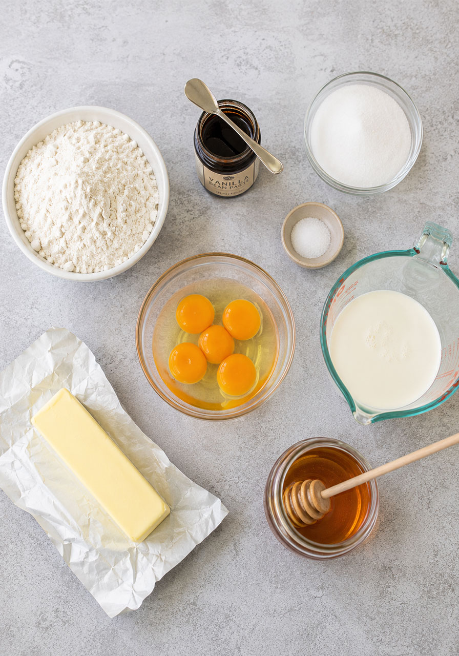 Ingredients needed to make moist honey tea cake including honey, butter, and egg yolks
