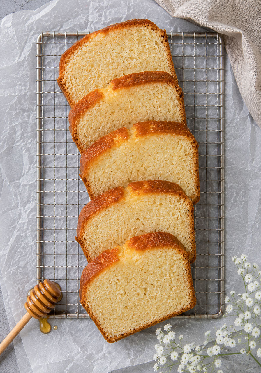 Overhead view of moist honey tea cake slices ready to serve