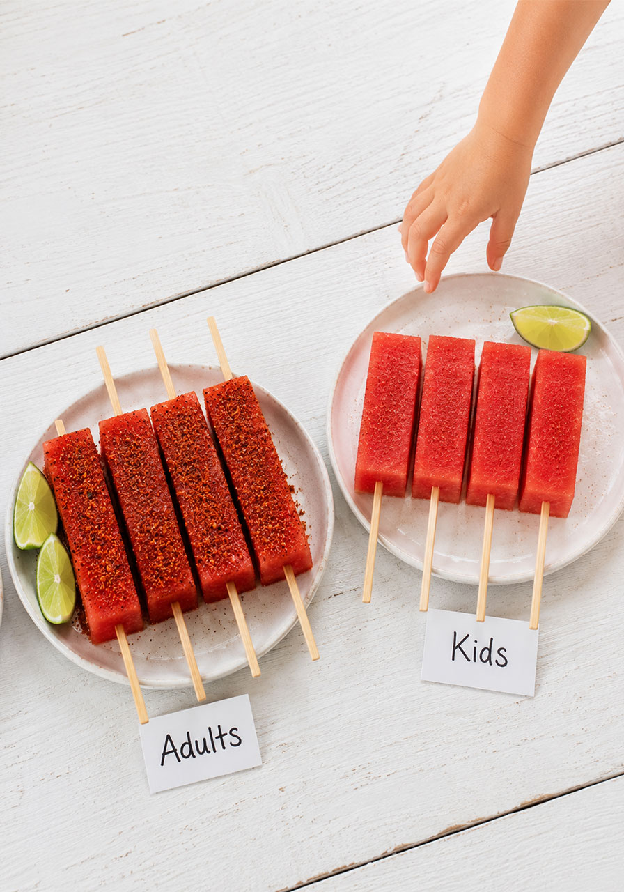 Side-by-side comparison of adult Tajín watermelon skewers and kid-friendly lightly seasoned version