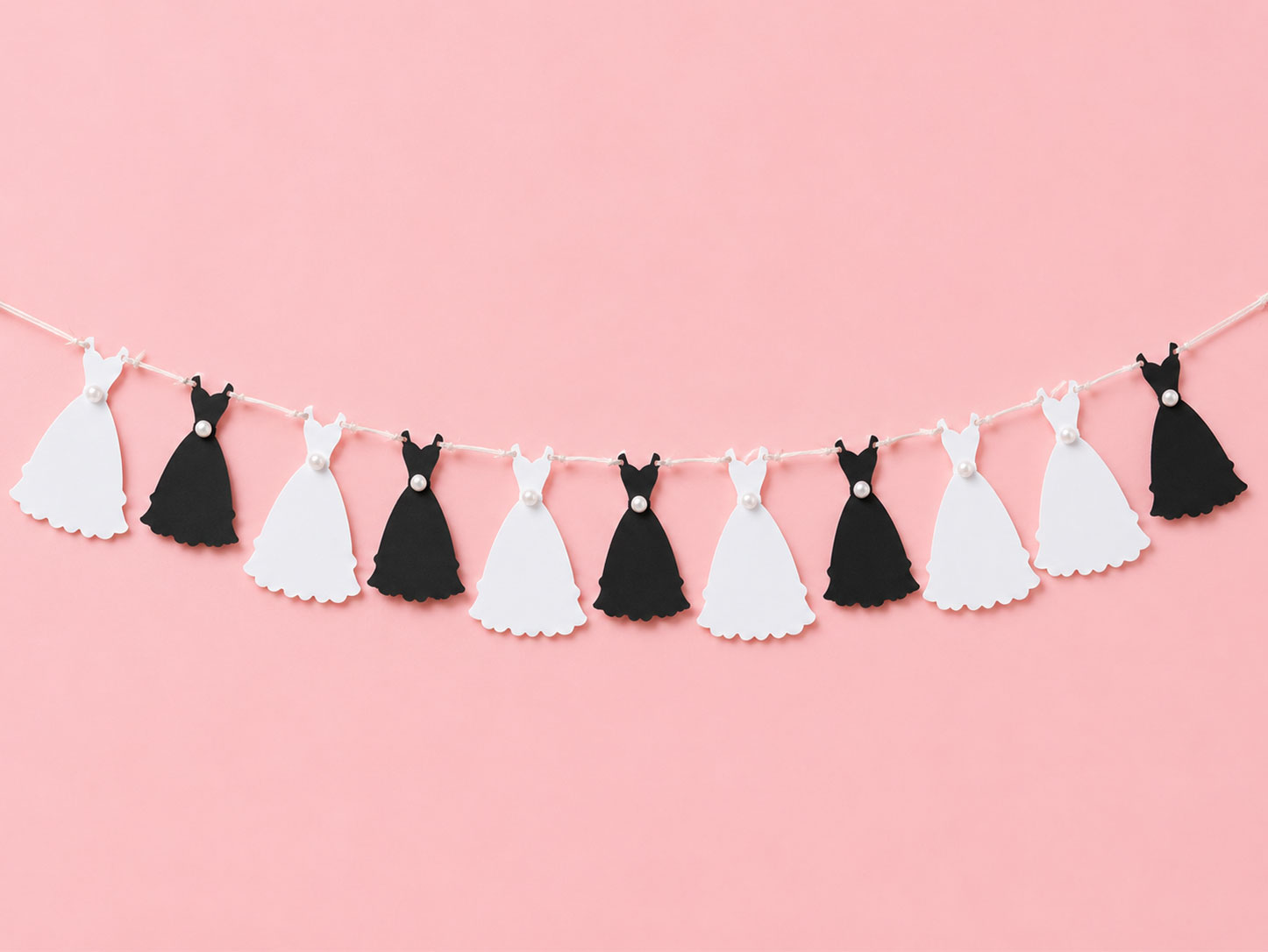 DIY mini wedding dress bunting cut with Cricut from white and black cardstock — bridal shower decoration idea