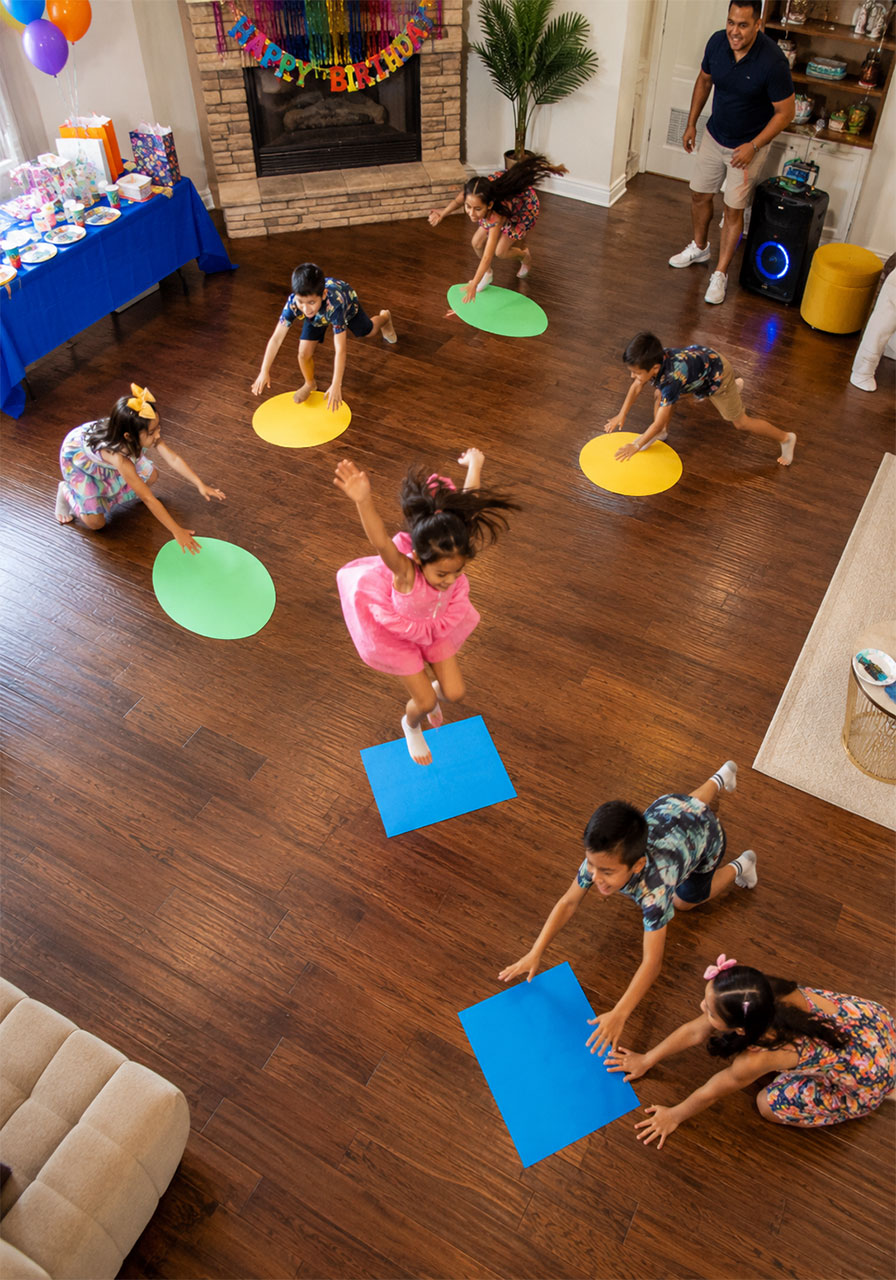 Children playing Musical Islands party game at an under the sea kids birthday party activity