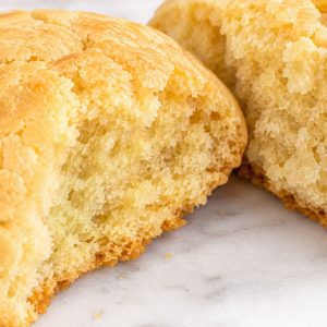 Old fashioned Southern tea cake broken in half showing soft fluffy interior texture
