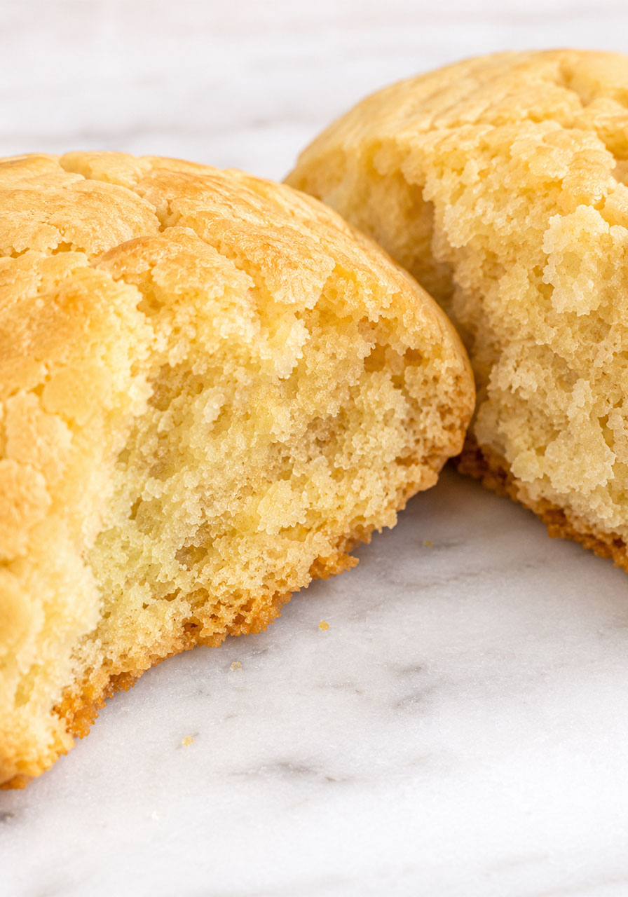 Old fashioned Southern tea cake broken in half showing soft fluffy interior texture