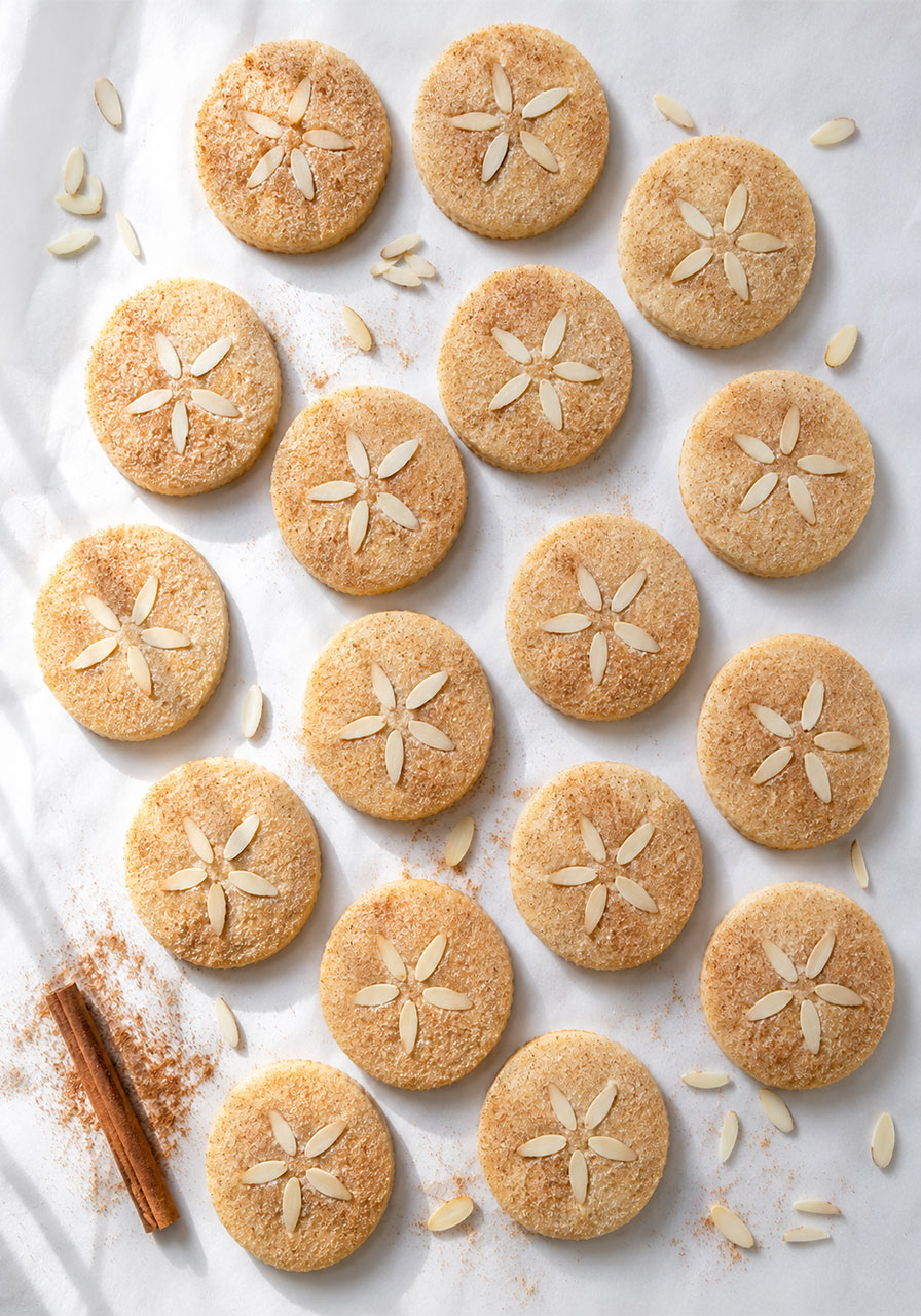 Sand dollar almond shortbread cookies with slivered almond design and cinnamon sugar – elegant beach party dessert