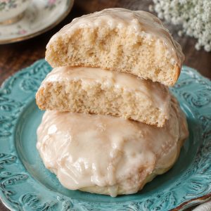 Southern tea cakes sliced in half showing moist dense interior with almond glaze