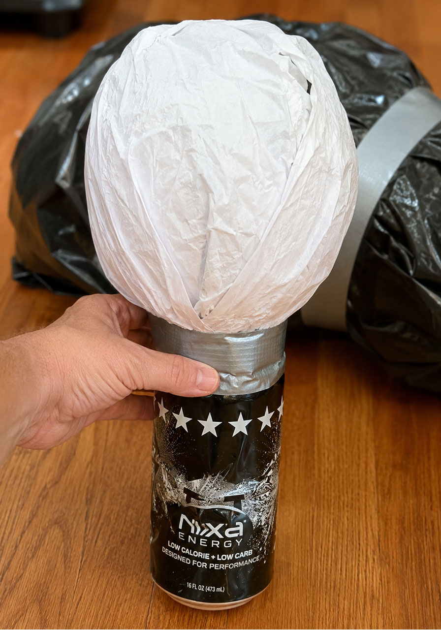 Paper ball head taped to a metal can to form the neck of a Halloween prop
