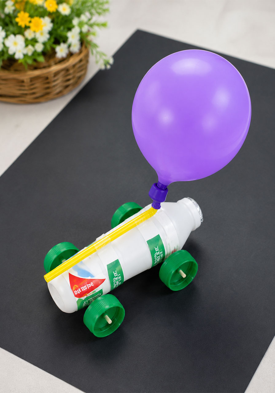 Finished simple recycled balloon car STEM project ready to race