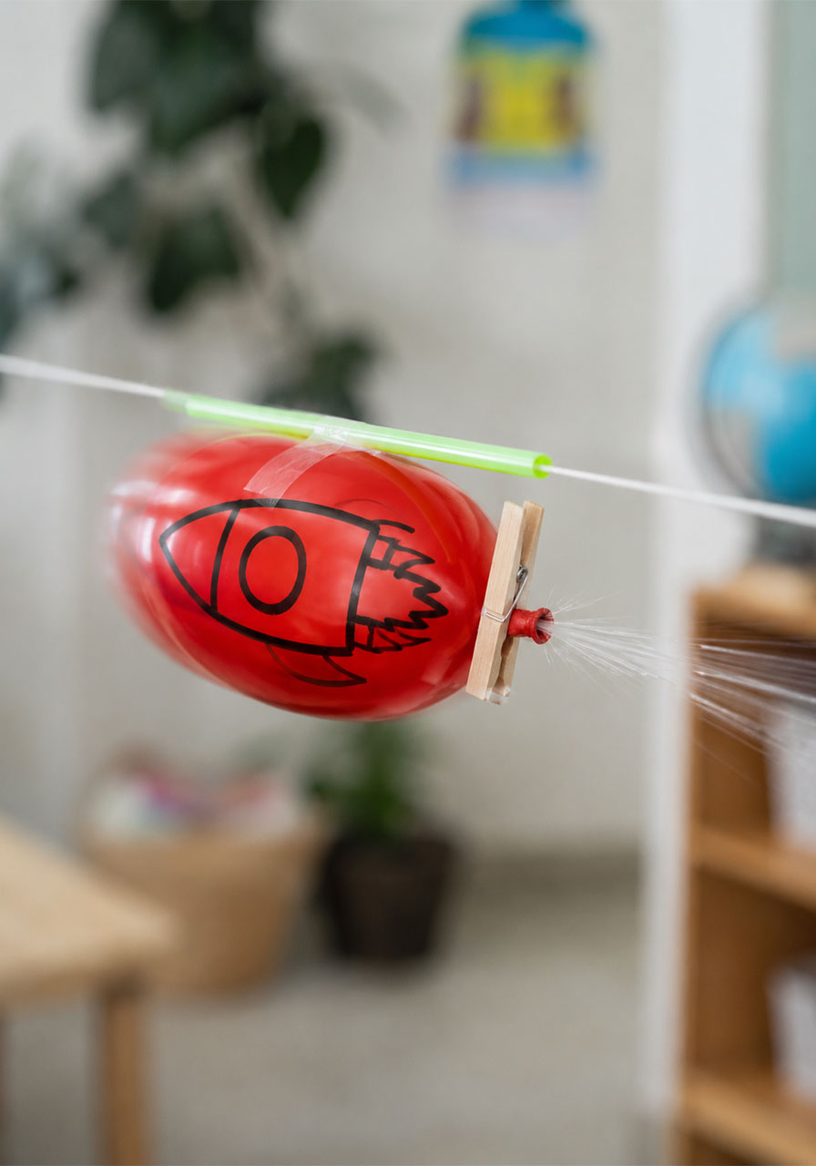 Air escaping a balloon rocket demonstrates Newton's Third Law of Motion in this STEM experiment