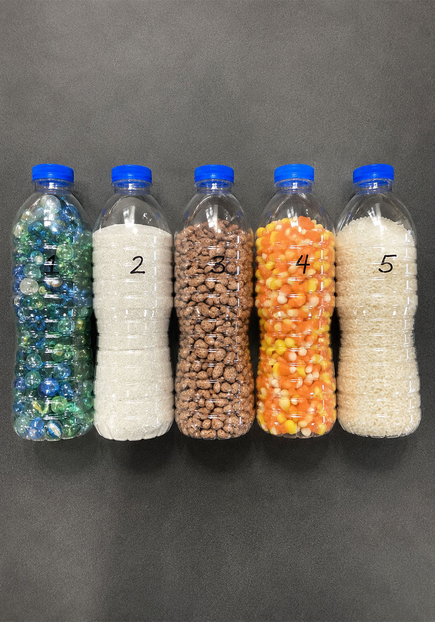 Beans, rice, sand, and marbles used for bottle flip STEM design challenge