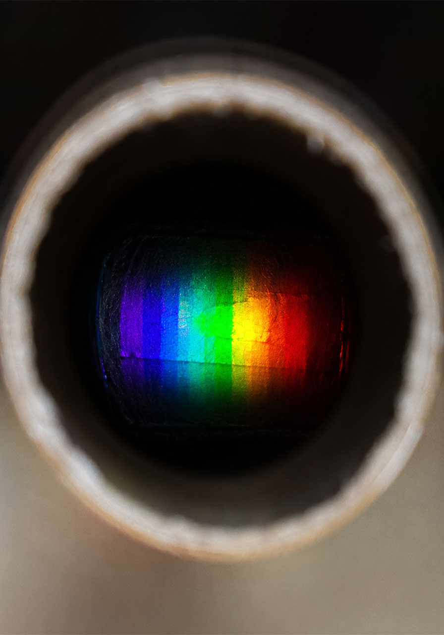 Rainbow spectrum seen through a homemade cardboard spectrometer eyepiece
