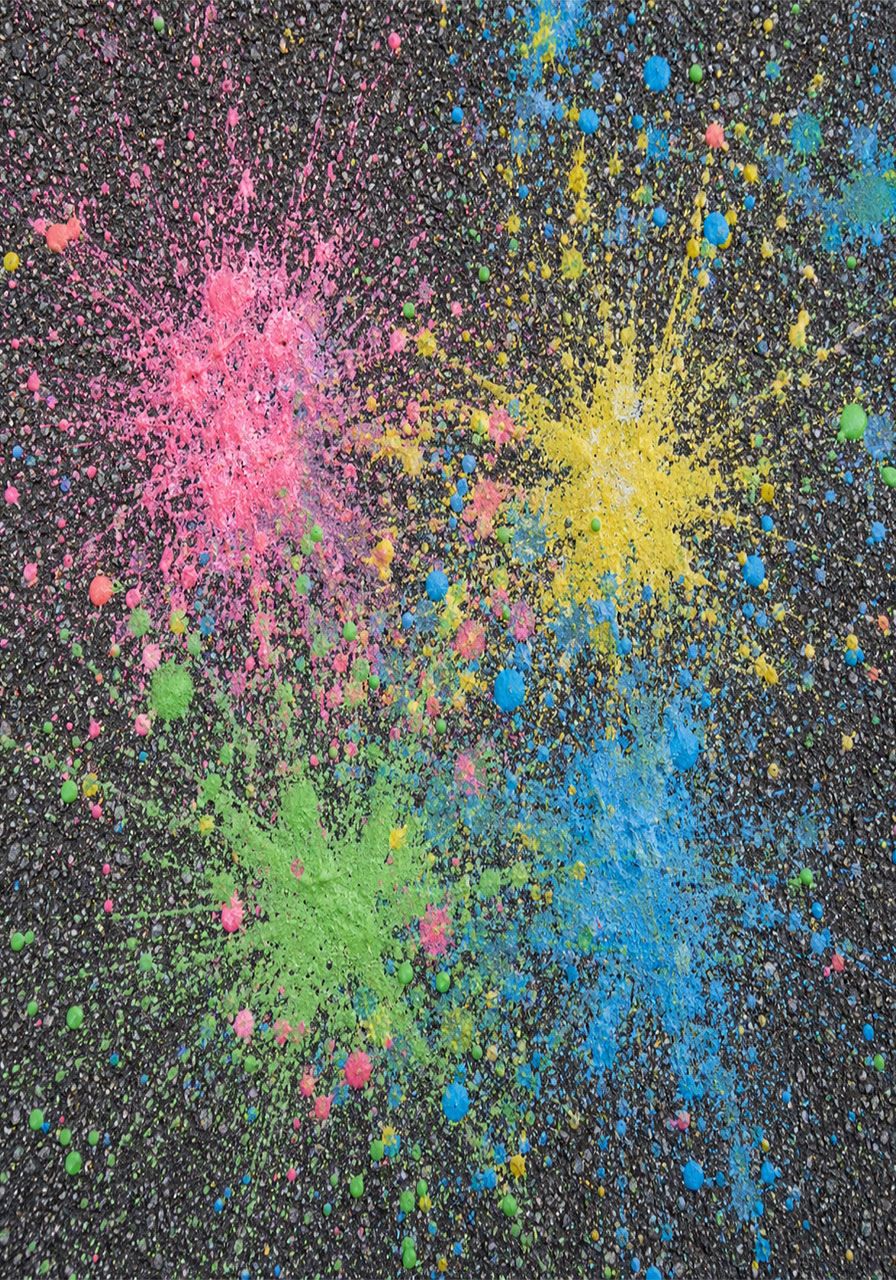 Colorful splatter pattern left behind after chalk rocket explosions