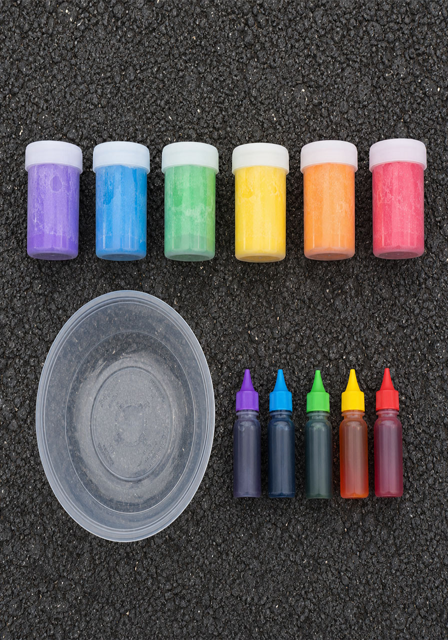 Materials needed for chalk rockets STEM activity including cornstarch and food coloring