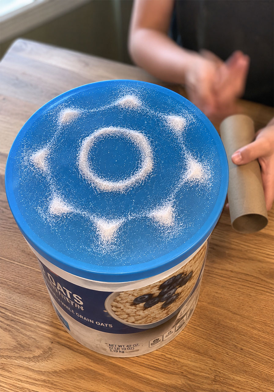Salt forming visible sound wave pattern on a homemade Chladni plate