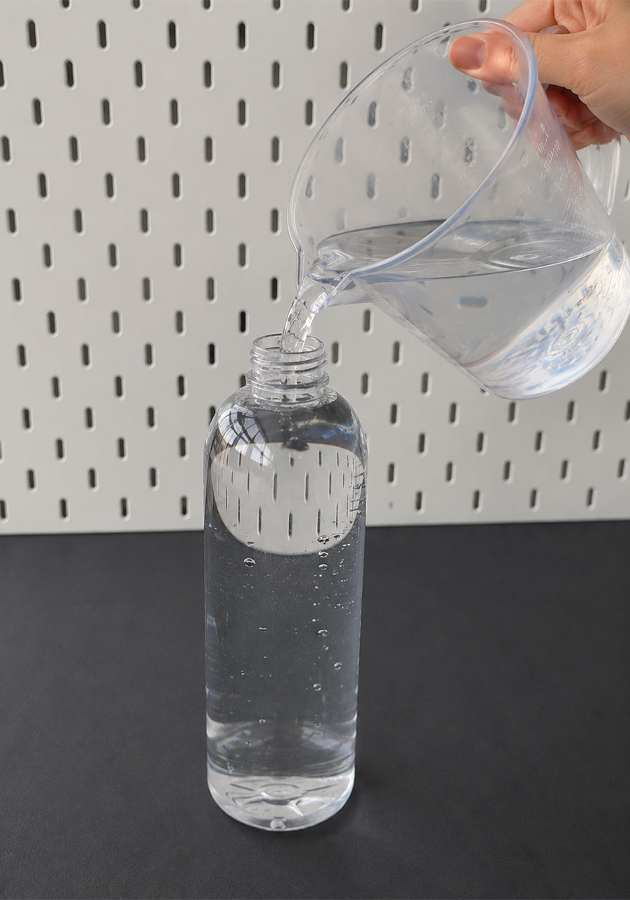 Filling bottle completely with water for Cartesian diver STEM activity