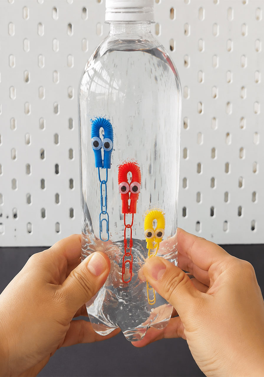 Squeezing bottle causes octopus divers to sink STEM buoyancy demo
