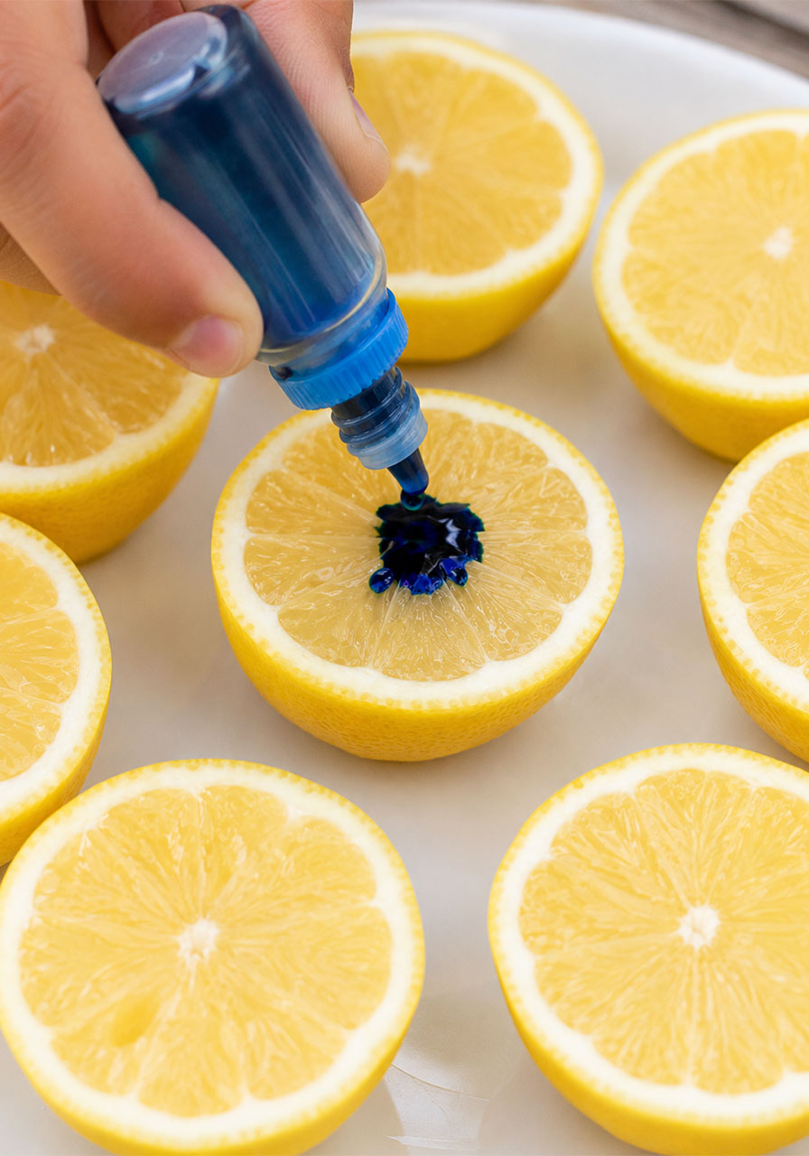 Adding gel food coloring to lemon before baking soda reaction
