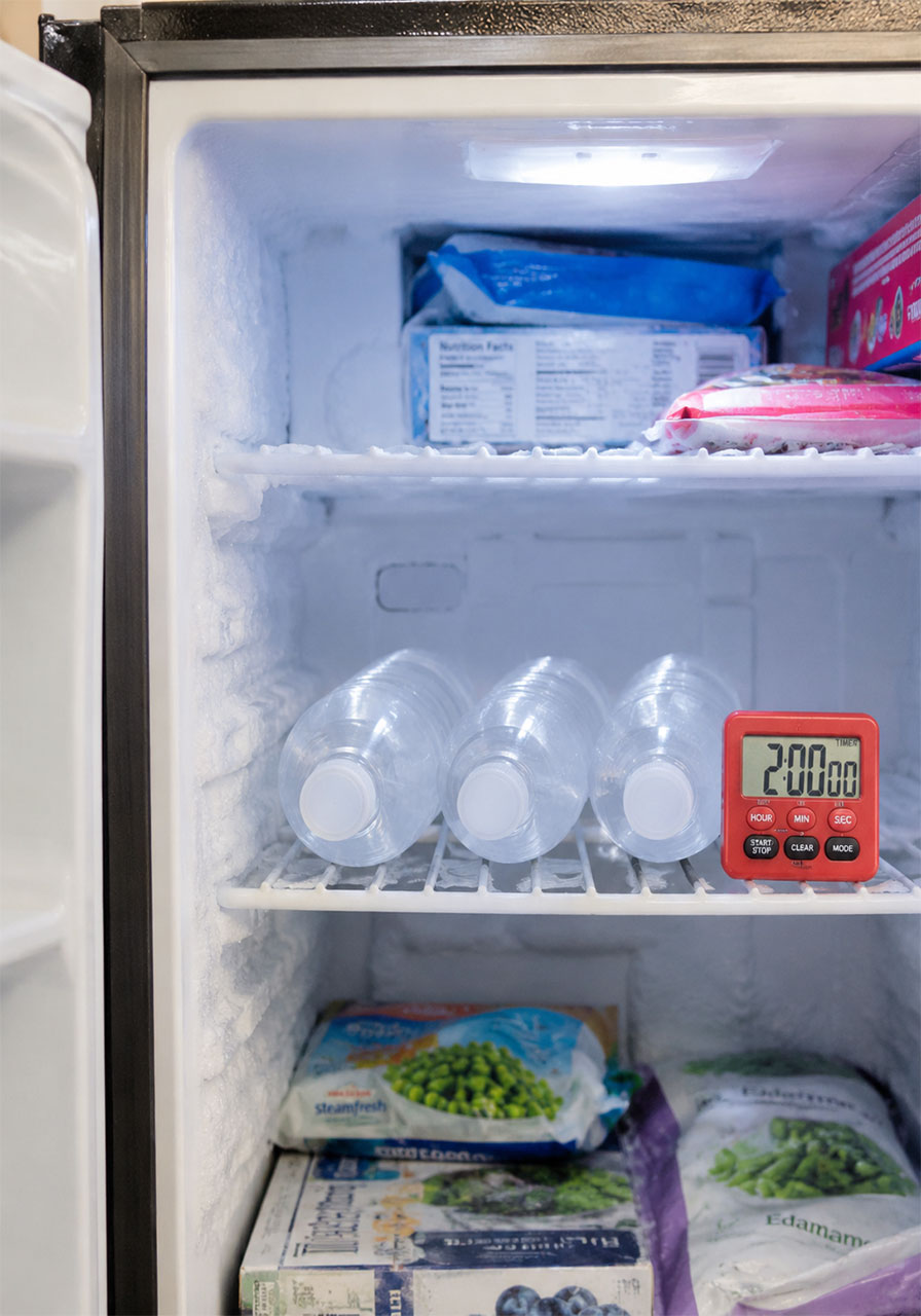 Bottled water lying on its side in the freezer for the instant ice science experiment