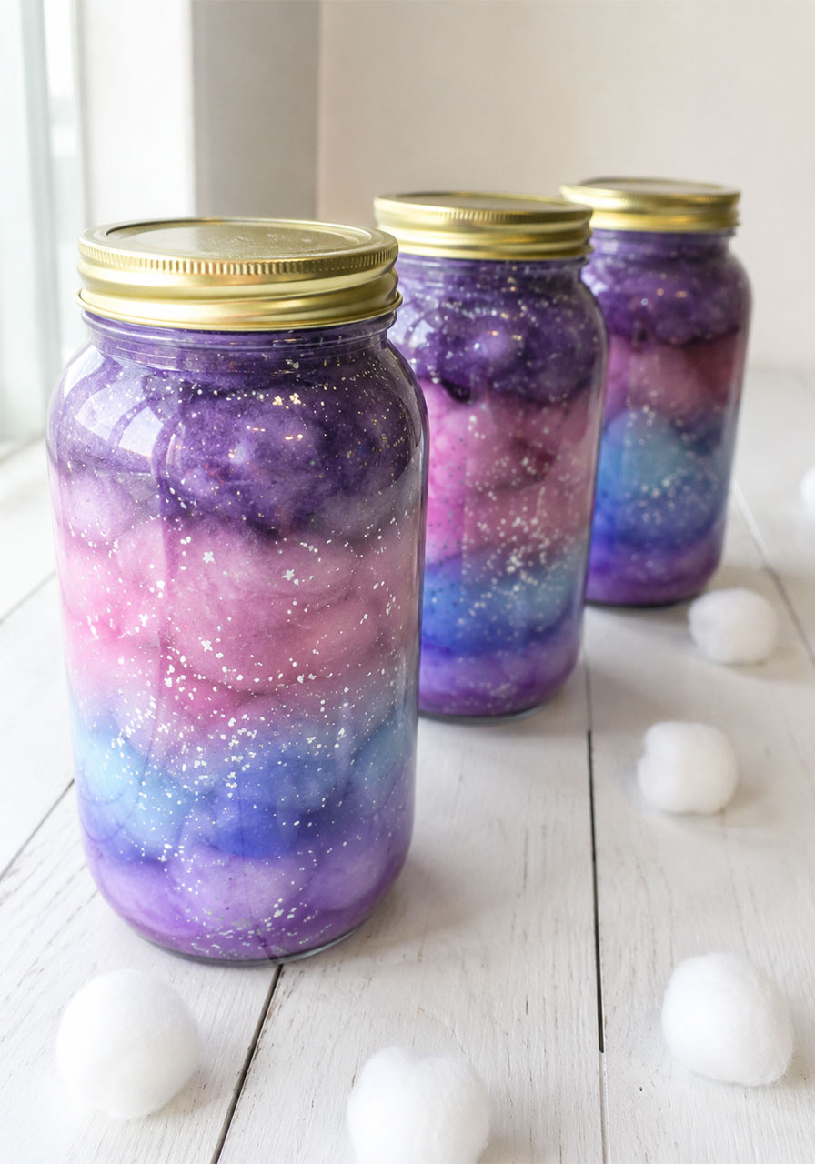 Finished galaxy jar kids STEM activity showing layered purple and blue colors
