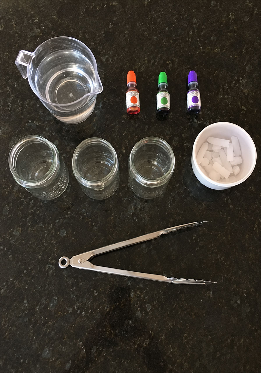 Supplies needed for Halloween potions science experiment including dry ice and mason jars