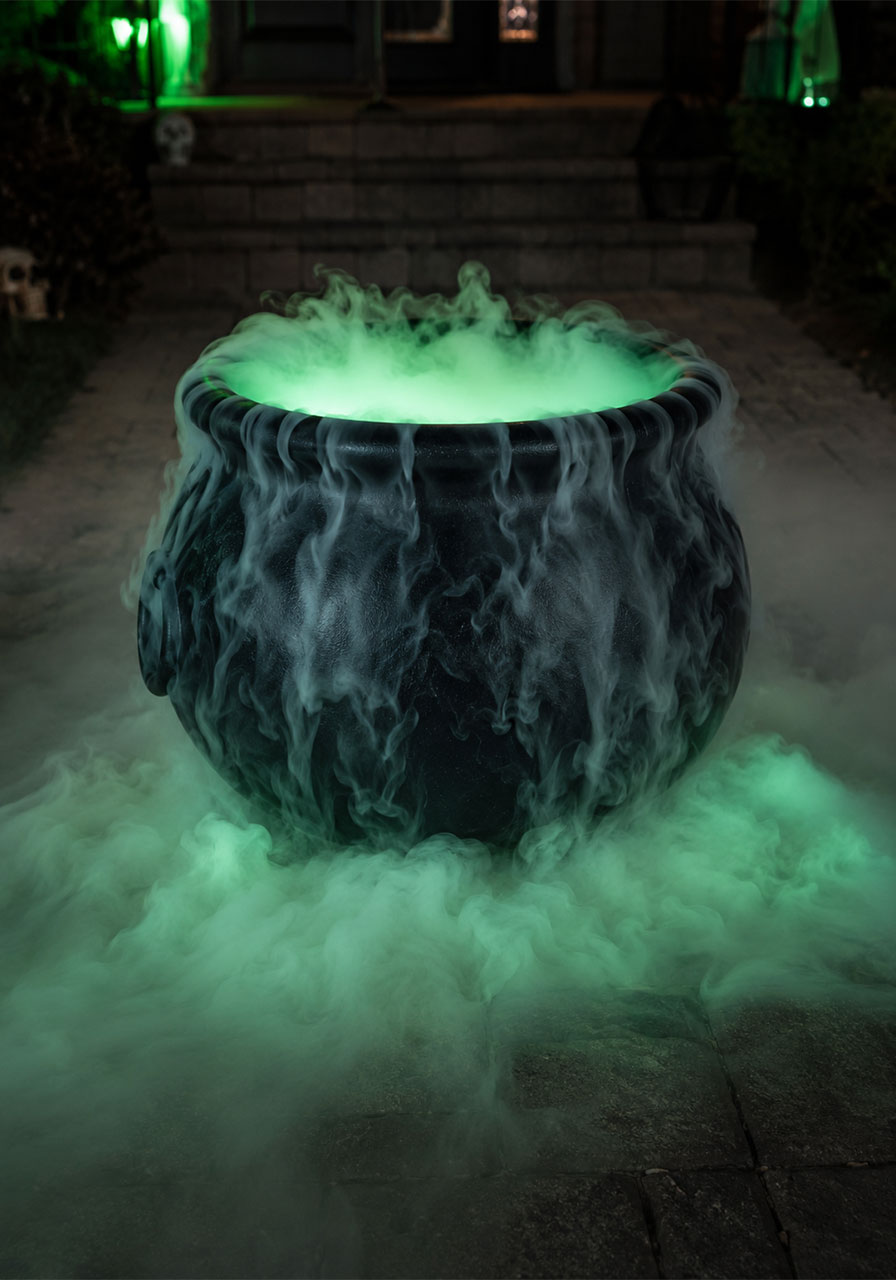 Bubbling green fog cauldron creating a spooky Halloween walkway entrance