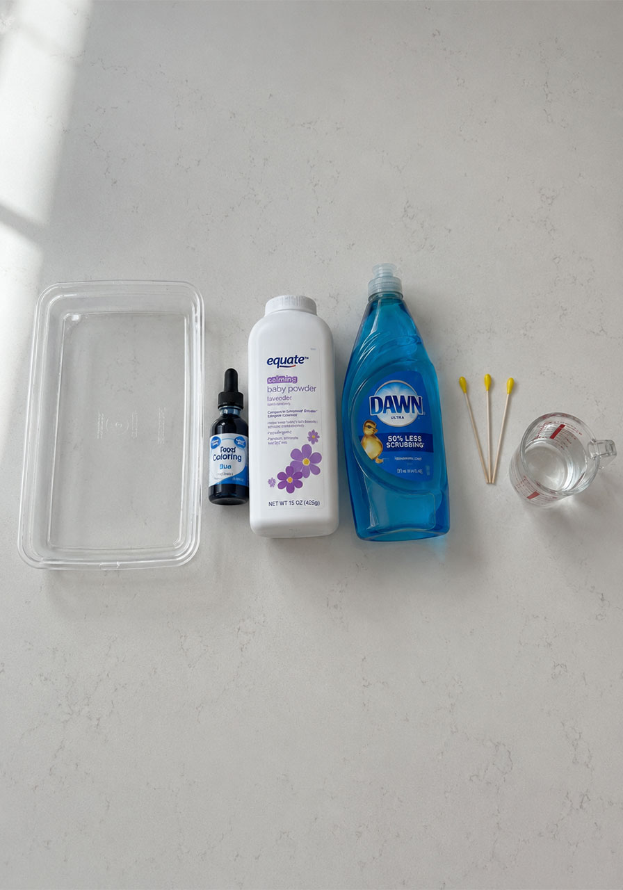 Materials needed for ice cracking experiment including food coloring baby powder and dish soap