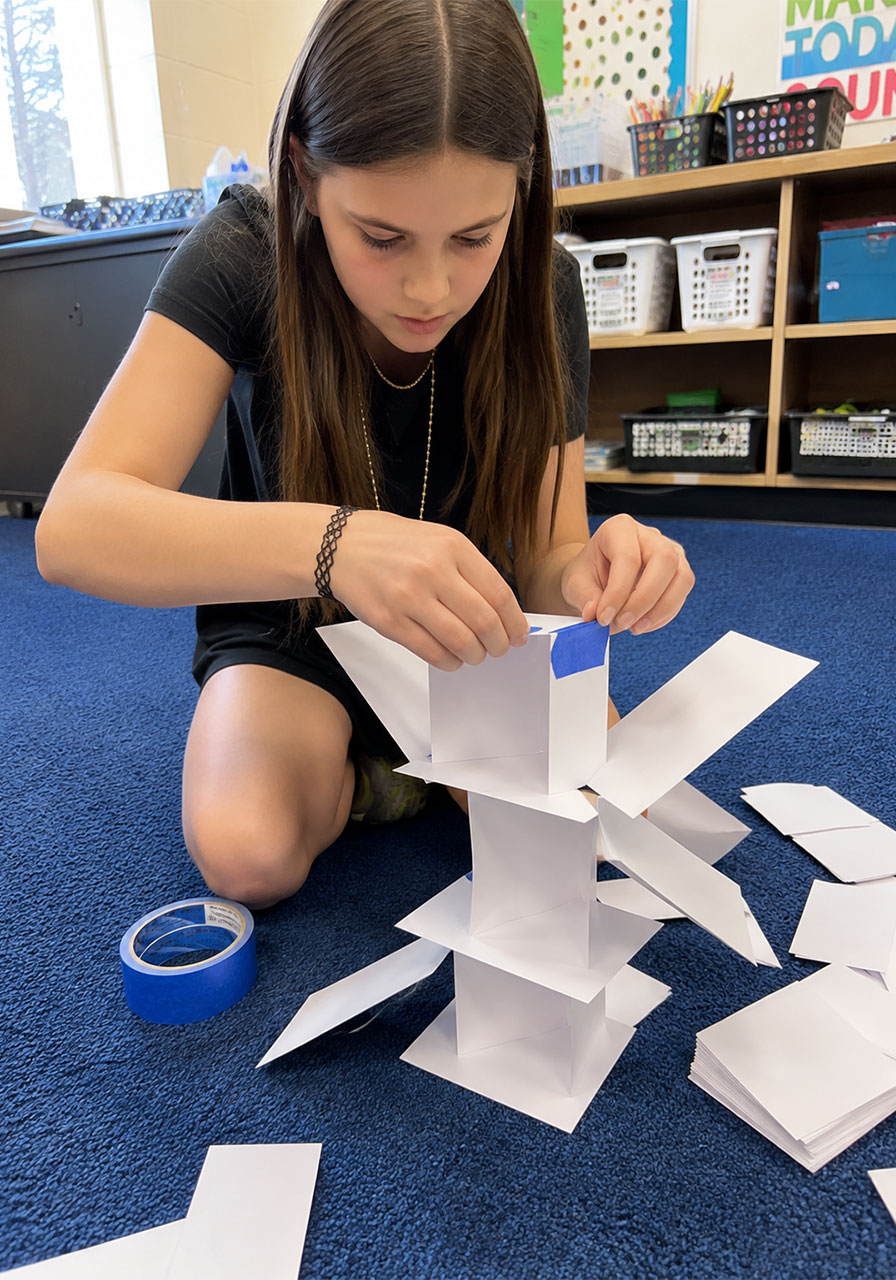 Creative sculptural index card tower design using tape for STEM class
