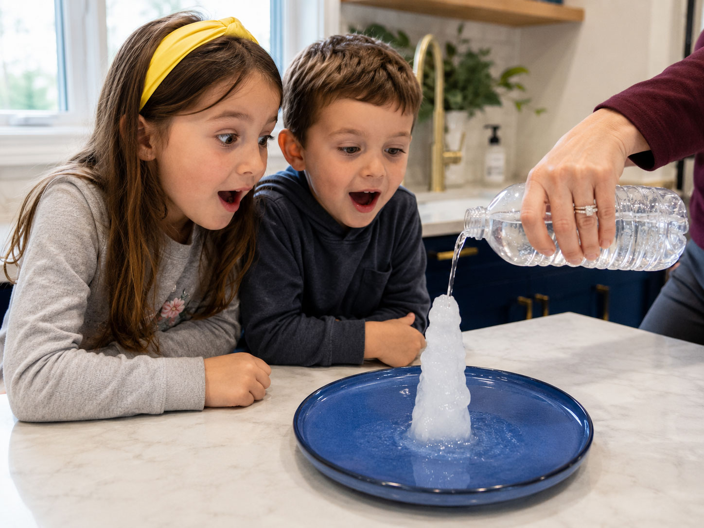 Kids amazed as water instantly freezes into an ice tower during the science experiment