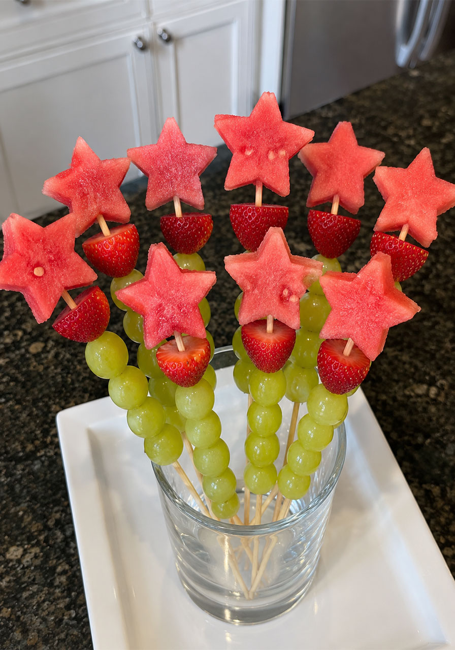 Watermelon star and grape magic wand fruit skewers for a healthy princess party snack